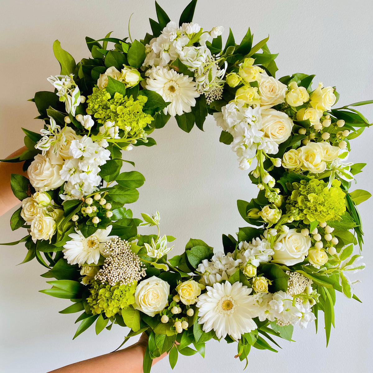 White wreath arranged by a florist in East Greenwich, RI : Busy Bee Florist